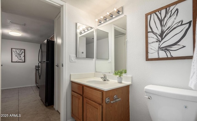3511 E Baseline Rd Unit 1235, Phoenix, AZ 85042 - bathroom with toilet, tile patterned flooring, and vanity
