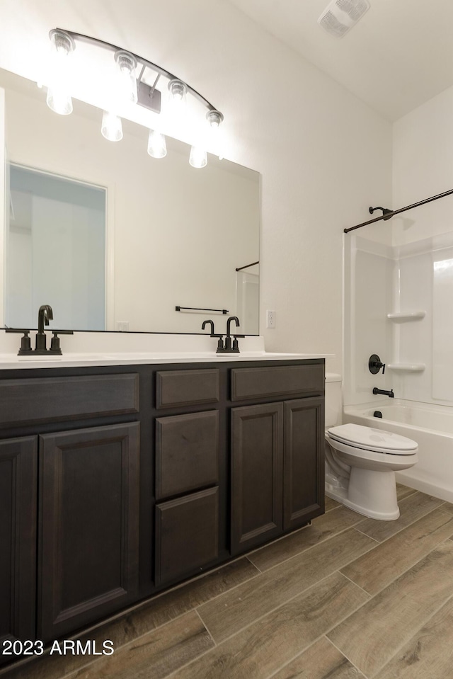 full bathroom featuring vanity, toilet, and bathing tub / shower combination