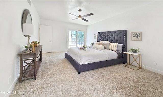 bedroom featuring light colored carpet, ceiling fan, and vaulted ceiling