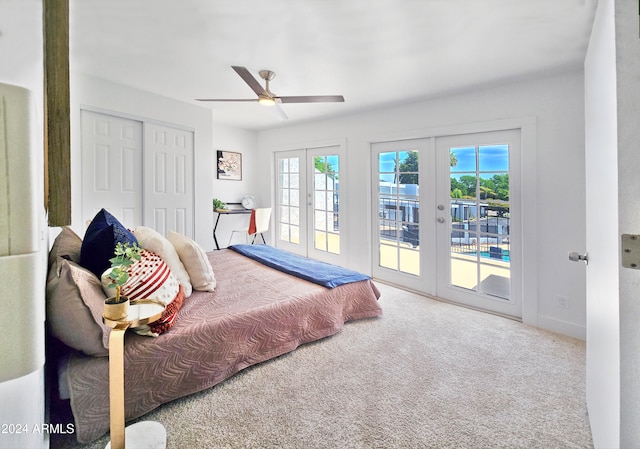 carpeted bedroom with multiple windows, french doors, and access to outside