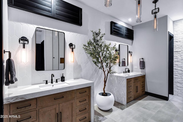 full bath with two vanities and a sink