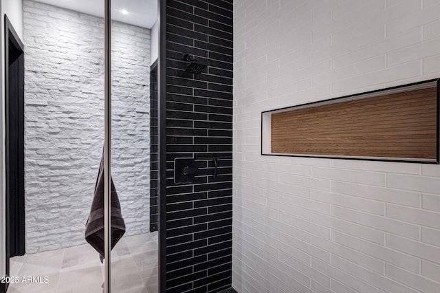 full bath with tiled shower