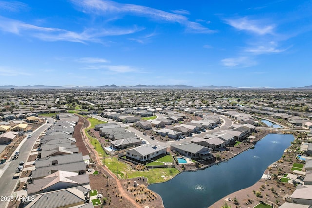 bird's eye view with a water and mountain view and a residential view