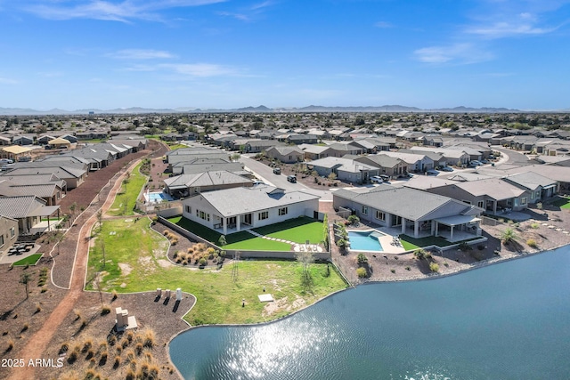 birds eye view of property featuring a residential view and a water and mountain view