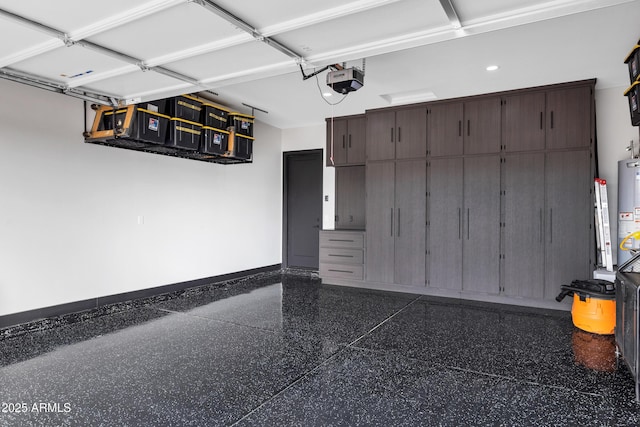 garage with a garage door opener and gas water heater