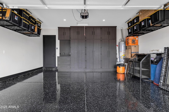 garage with gas water heater and recessed lighting