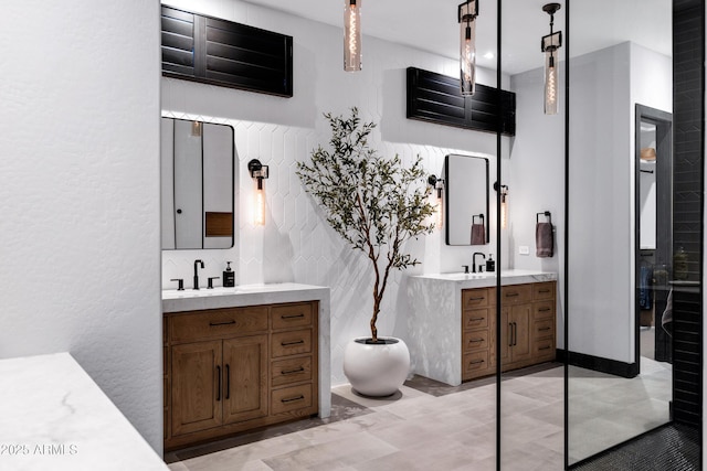 full bathroom featuring two vanities and a sink