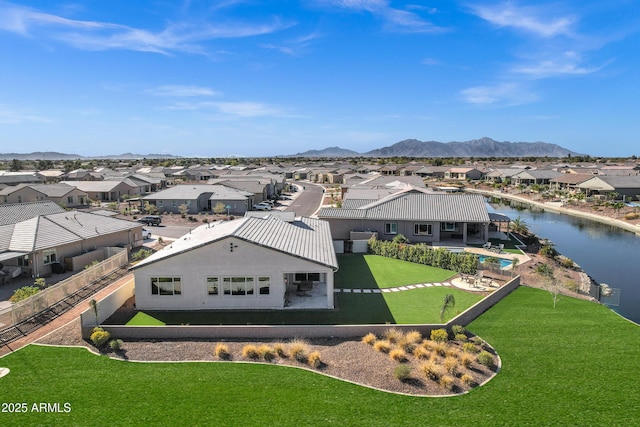 drone / aerial view featuring a residential view and a mountain view