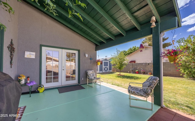 view of patio / terrace featuring a storage shed, an outdoor structure, french doors, and a fenced backyard