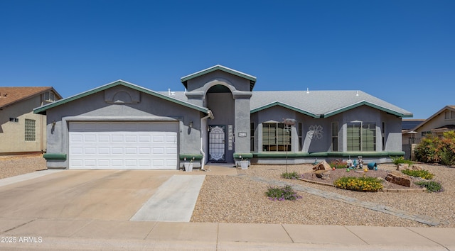 single story home featuring stucco siding, driveway, and a garage