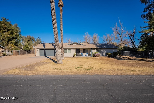 ranch-style home featuring a garage