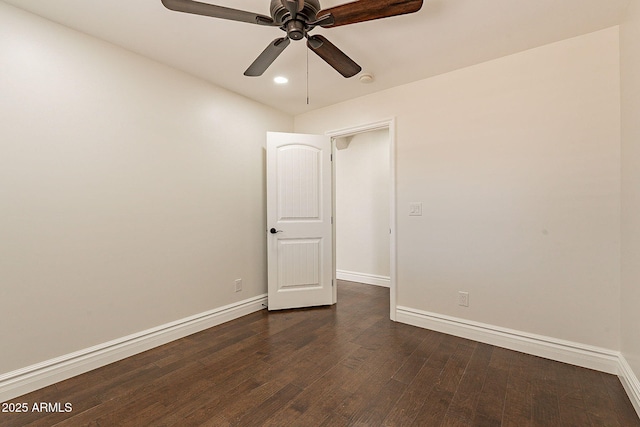 unfurnished room featuring ceiling fan and dark hardwood / wood-style flooring