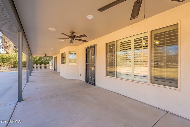 view of patio featuring ceiling fan