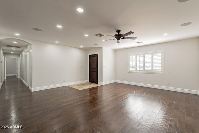 unfurnished room with dark hardwood / wood-style floors and ceiling fan