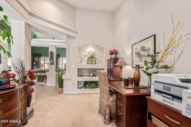 carpeted office with a high ceiling