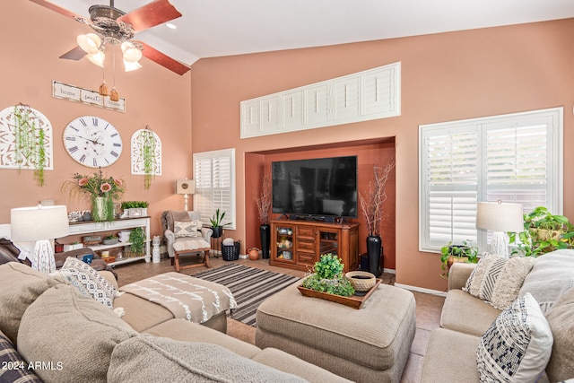 carpeted living room featuring lofted ceiling and ceiling fan