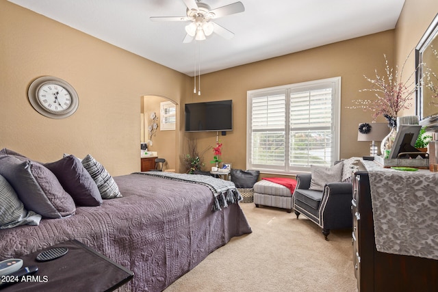 bedroom featuring ceiling fan and light carpet