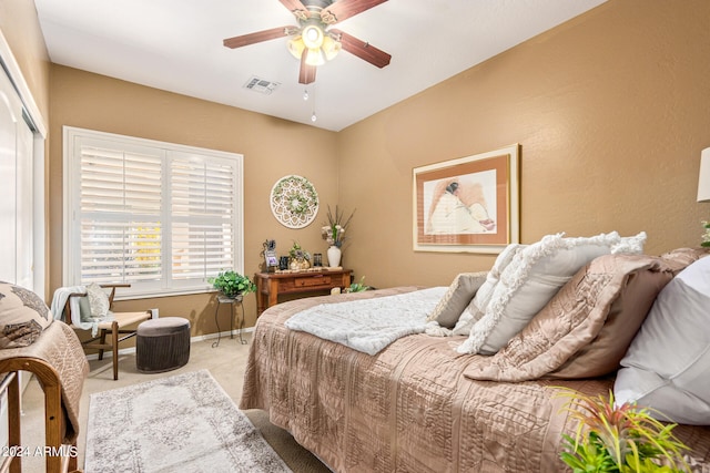 bedroom with carpet flooring, ceiling fan, and a closet