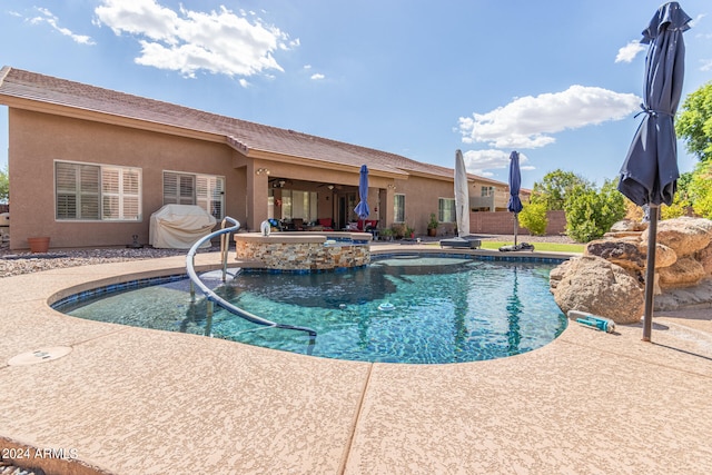 view of swimming pool with a patio