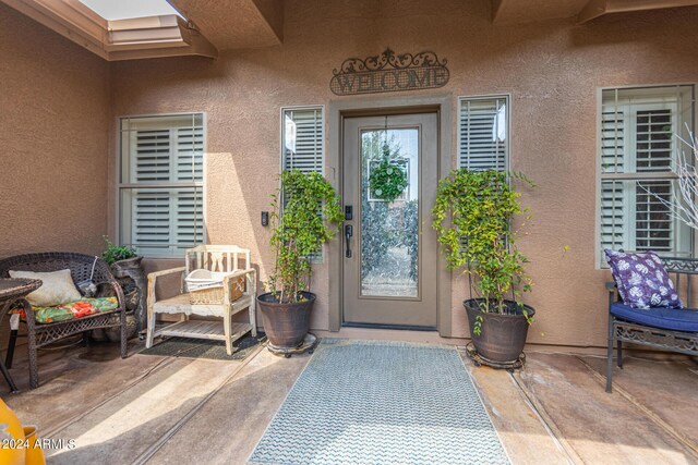 doorway to property with a patio