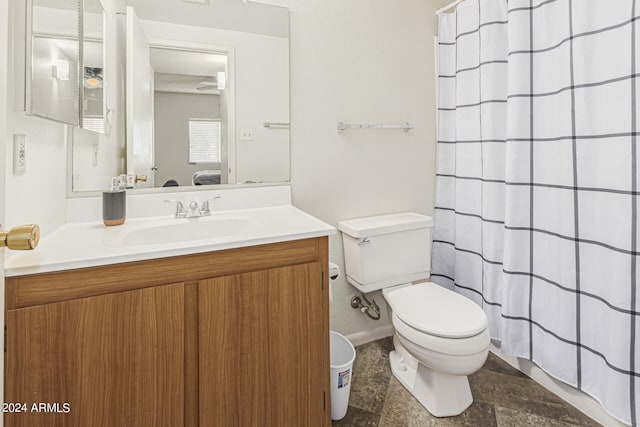 bathroom with vanity, toilet, and a shower with shower curtain