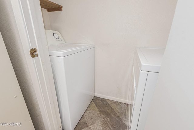 washroom with washer / dryer