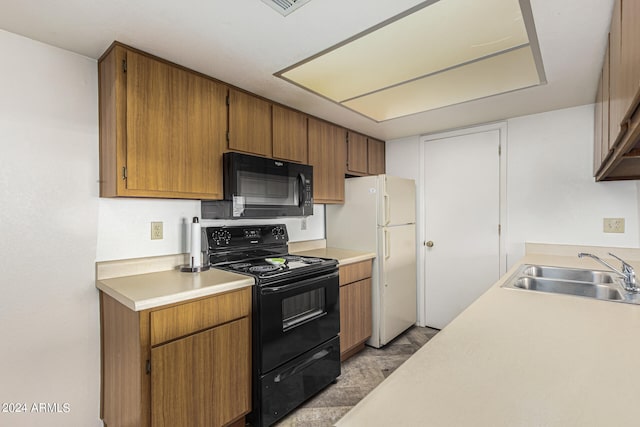 kitchen with black appliances and sink