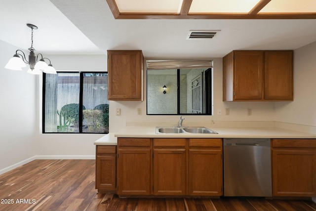 kitchen with dishwasher, sink, hanging light fixtures, an inviting chandelier, and dark hardwood / wood-style floors