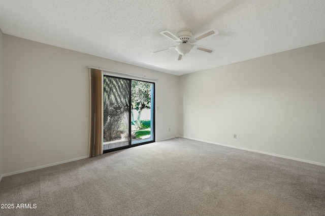 carpeted empty room with a textured ceiling and ceiling fan