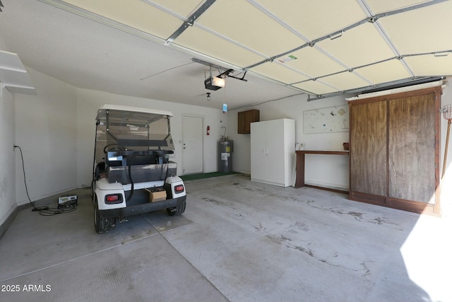 garage featuring water heater and a garage door opener