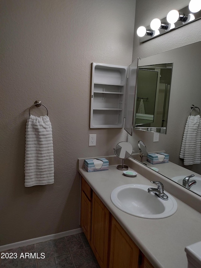 bathroom with vanity and tile patterned floors