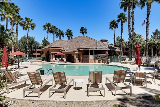 view of swimming pool with a patio area