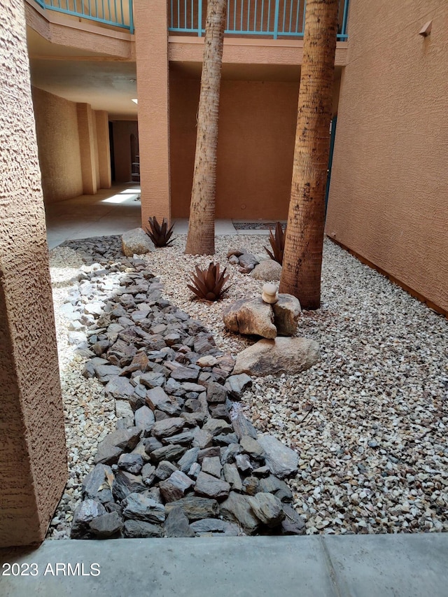 view of yard with a balcony