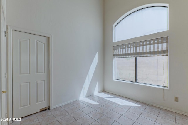 spare room with light tile patterned floors