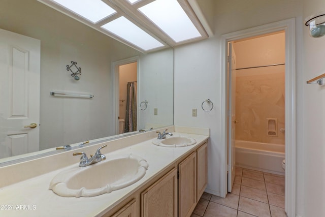 full bathroom featuring toilet, shower / bath combination with curtain, vanity, and tile patterned floors