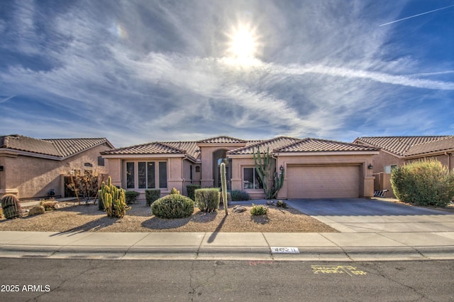 mediterranean / spanish-style house featuring a garage