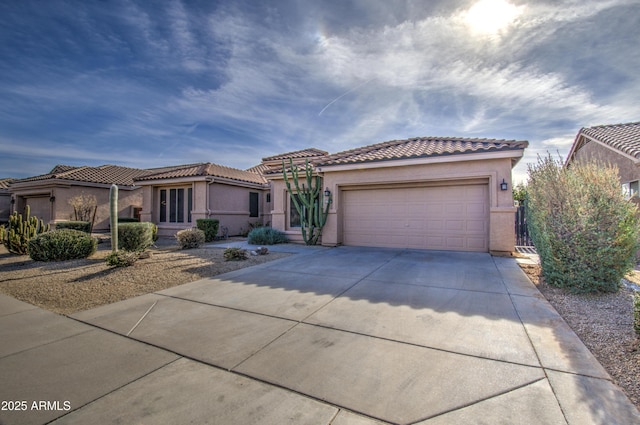 mediterranean / spanish-style home featuring a garage