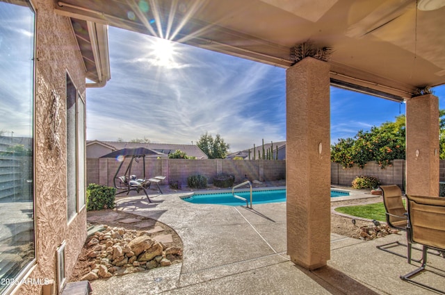 view of pool featuring a patio