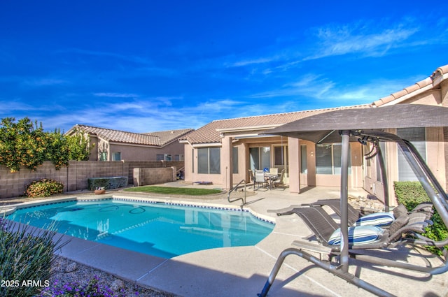 view of pool featuring a patio