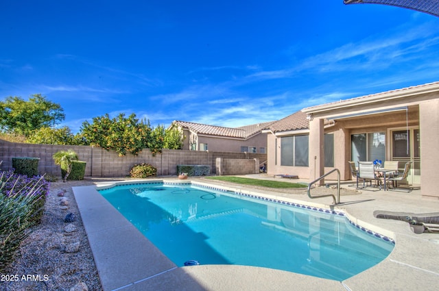 view of pool featuring a patio area