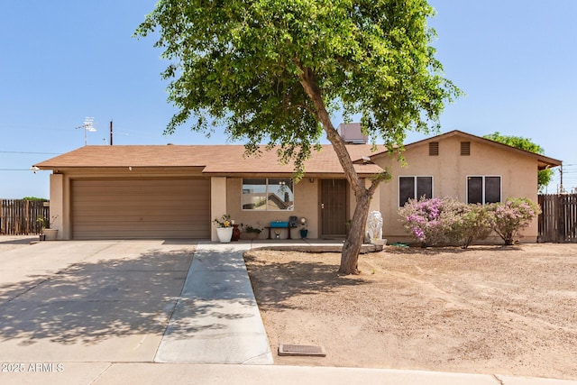 4712 W Juniper Ave, Glendale, AZ 85306 - ranch-style house with stucco siding, driveway, and an attached garage