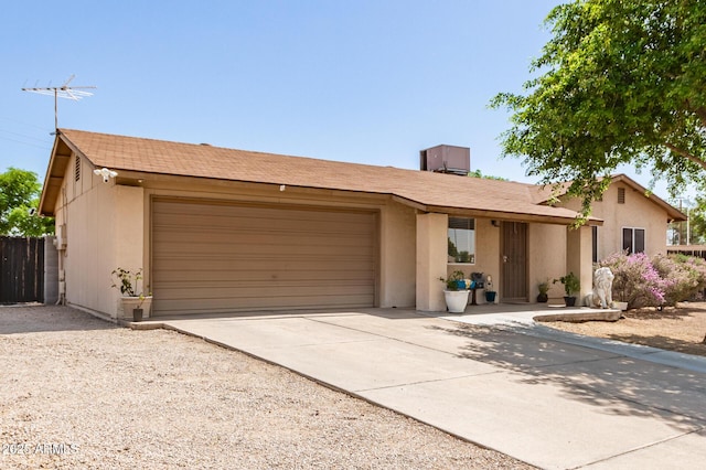 4712 W Juniper Ave, Glendale, AZ 85306 - ranch-style house featuring a garage, driveway, and stucco siding