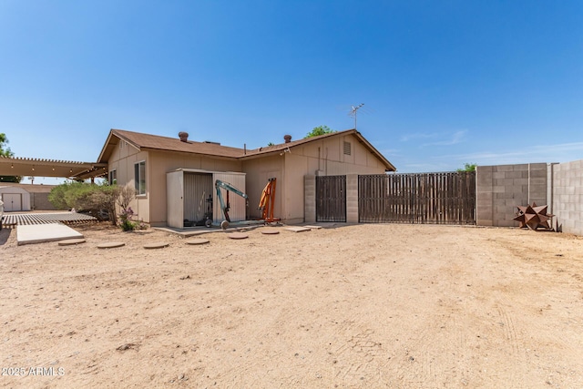 4712 W Juniper Ave, Glendale, AZ 85306 - rear view of house featuring a storage shed