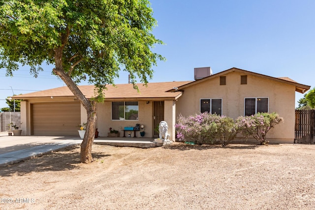 4712 W Juniper Ave, Glendale, AZ 85306 - ranch-style home with concrete driveway, stucco siding, and a garage