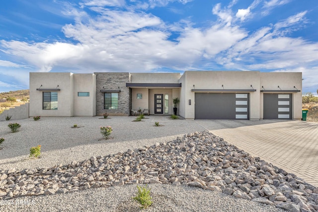 southwest-style home with a garage