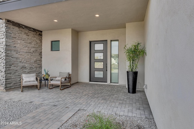 doorway to property featuring a patio area