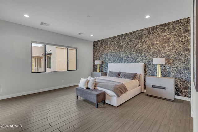 bedroom with light hardwood / wood-style floors