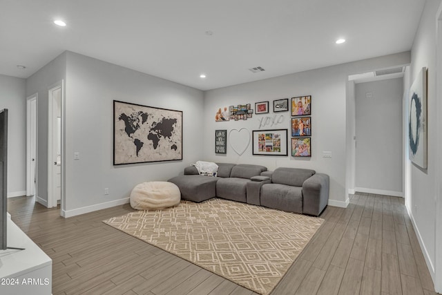 living room with light hardwood / wood-style flooring