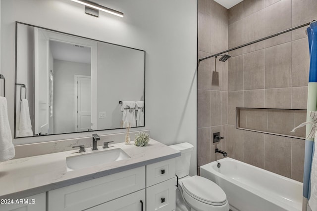 full bathroom featuring shower / bath combo, vanity, and toilet