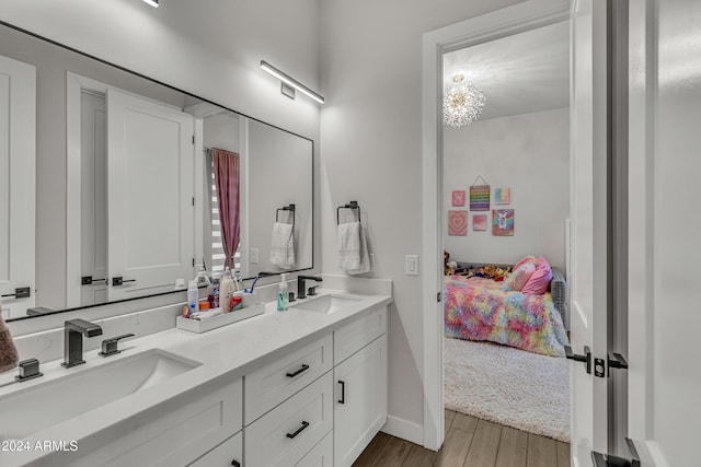 bathroom with wood-type flooring and vanity